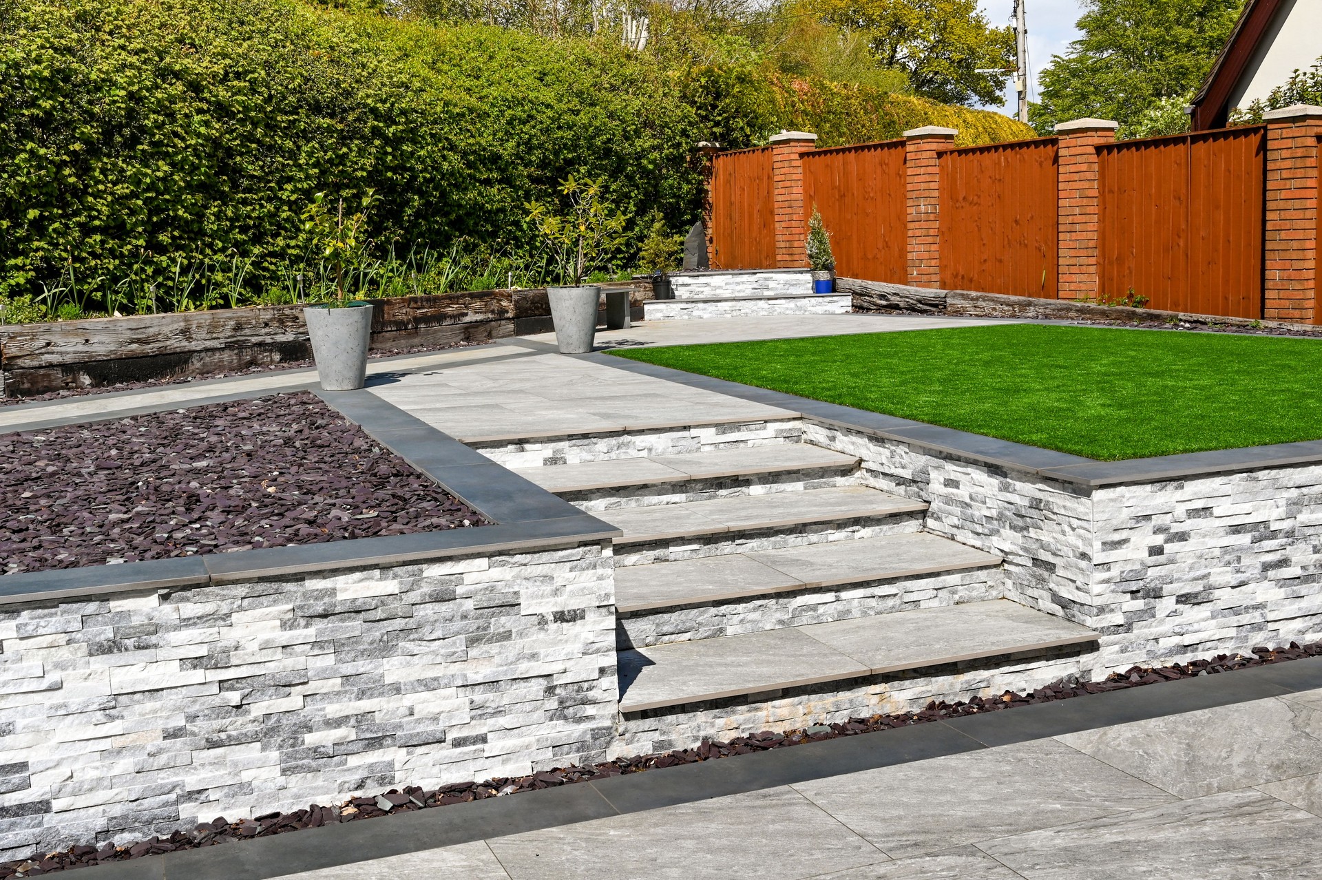 Residential garden landscaped with porcelain paving slabs